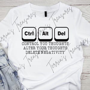 May include: White t-shirt with a black graphic featuring three keyboard keys: Ctrl, Alt, and Del. Below the keys, the text reads: "CONTROL YOUR THOUGHTS, ALTER YOUR THOUGHTS, DELETE NEGATIVITY."