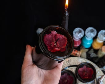 Karmozijnrode orchidee donkere godin kaars