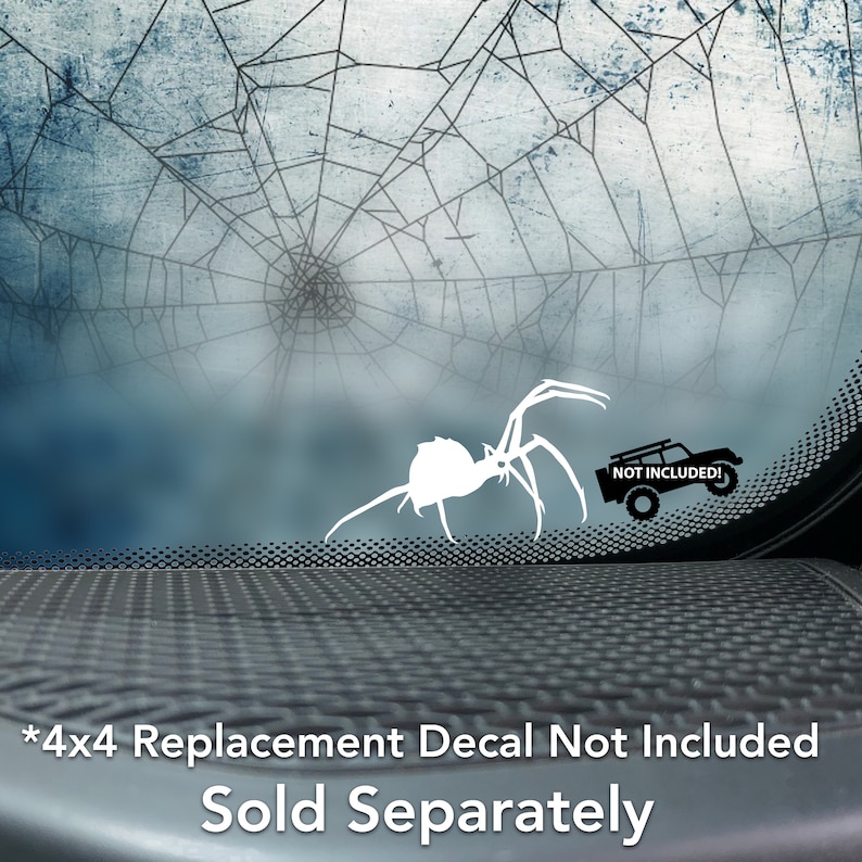 May include: White spider decal with a black spider web background. The decal is on a car window. The text "NOT INCLUDED!" is on a black jeep decal in the bottom right corner of the image.