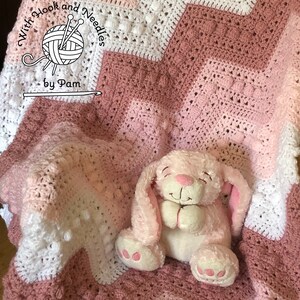 Hugs and Kisses baby blanket in shades of pink and white