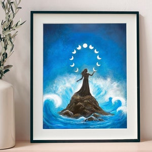 May include: A painting depicting a woman standing on a rock in the ocean, surrounded by a circle of moons. The woman is silhouetted against a blue sky, and the waves are crashing around her.