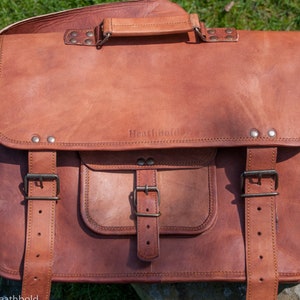 Satchel bag with closed flap front view