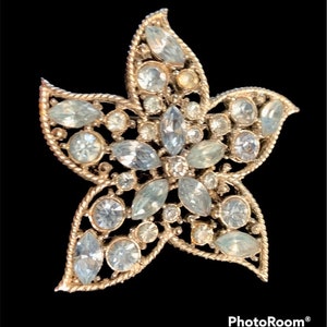 Pretty star shaped blue and crystal rhinestone brooch pin signed by maker