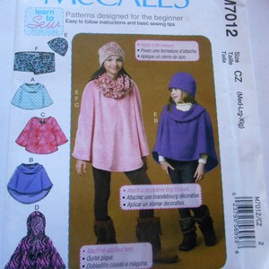 May include: Sewing pattern for a poncho with a decorative frog closure. The pattern includes instructions for making five different styles of ponchos, including a pink, purple, blue, and zebra print poncho. The pattern is for sizes medium, large, and extra large.