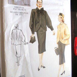 May include: Vintage Vogue sewing pattern for a dress, featuring two women in black and yellow dresses. The pattern is from 1947 and is labeled "Original 1947 Design".