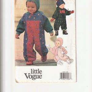 May include: A vintage sewing pattern from Little Vogue featuring illustrations of baby snowsuits. The pattern includes multiple designs, with options in blue, red, green, and pink. The pattern number is 8793.