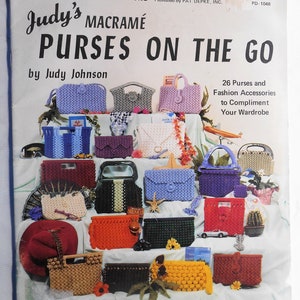 May include: A book cover with the title "Judy's Macrame Purses on the Go" by Judy Johnson. The cover features a colorful display of 26 macrame purses and accessories, including a variety of styles, colors, and textures. The book includes instructions for making these purses and accessories.