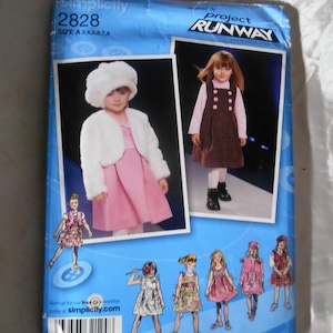 May include: Simplicity sewing pattern number 2828 for girls' dresses, sizes 3-8. The pattern is inspired by Project Runway and features a variety of styles, including a dress with a fur collar, a dress with a polka dot print, and a dress with a floral print.