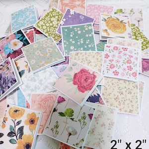 May include: A collection of square cards, each 2 x 2 inches, featuring various floral patterns. The cards display a range of colors, including pink, yellow, blue, and green, with designs such as roses, daisies, and other botanical illustrations. The cards are arranged in a pile.