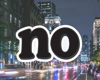 May include: A sticker with the word "no" in a bold, black font with a white outline. The sticker is superimposed on a nighttime city street scene with wet pavement, streetlights, and buildings.