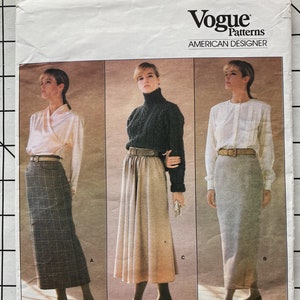May include: Vogue Patterns American Designer sewing pattern for a skirt by Calvin Klein. The pattern number is 1790. The pattern shows three different styles of skirts: a plaid skirt, a pleated skirt, and a straight skirt.