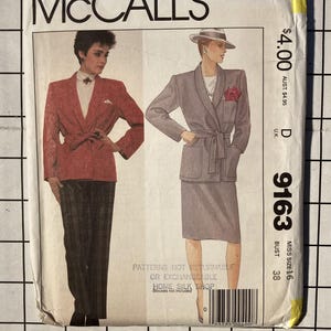 May include: A vintage McCall's sewing pattern envelope featuring illustrations of two women in suits. The envelope is primarily white with the McCall's logo at the top. The pattern number is 9163, and the price is $4.00.