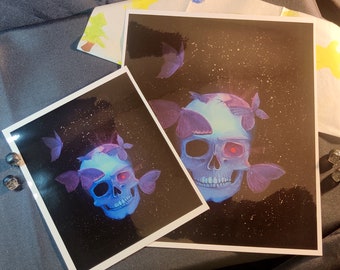 Deathly Attraction | A blue skull print of a painting with deadly glowing butterflies attracted to it
