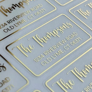 May include: Gold foil return address labels with the text "The Thompsons" and the address "1234 Riverview Road, Old Lyme, CT 06371".