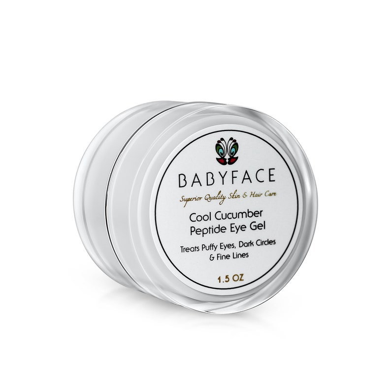 May include: A white jar of Cool Cucumber Peptide Eye Gel by BABYFACE, a brand that specialises in superior quality skin and hair care. The jar is labelled with the product name, ingredients, and size: 1.5 oz.