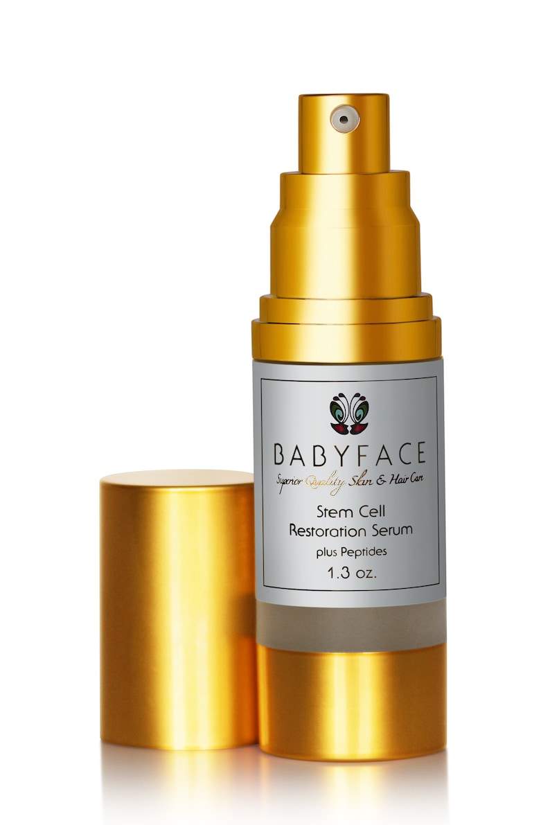 May include: A gold bottle with a pump dispenser containing a stem cell restoration serum with peptides. The bottle is labeled "BABYFACE Superior Quality Skin & Hair Care" and "1.3 oz."