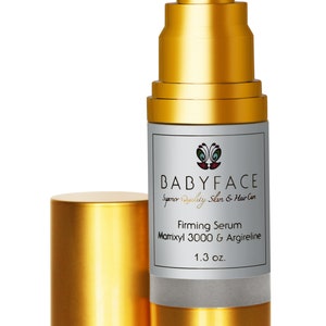 May include: A gold bottle with a pump dispenser containing a firming serum. The bottle is labeled "BABYFACE Superior Quality Skin & Hair Care Firming Serum Matrixyl 3000 & Argireline 1.3 oz."