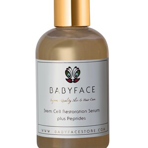 May include: A clear glass bottle with a gold cap and label. The label says "BABYFACE Superior Quality Skin & Hair Care Stem Cell Restoration Serum plus Peptides www.BABYFACESTORE.COM".
