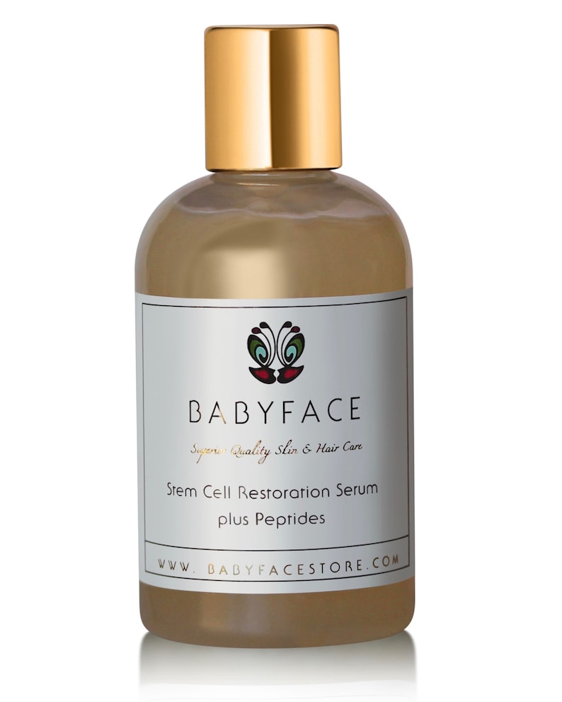 May include: A clear glass bottle with a gold cap and label. The label says "BABYFACE Superior Quality Skin & Hair Care Stem Cell Restoration Serum plus Peptides www.BABYFACESTORE.COM".