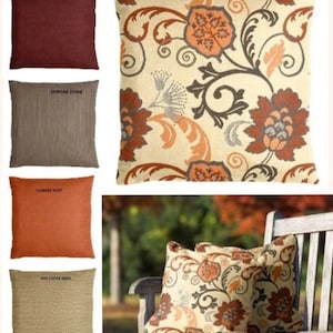 May include: Four decorative throw pillows with different textures and colors. The pillows are arranged in two rows of two. The top row features a burgundy pillow with the text "Canvas Herring" and a cream pillow with a floral pattern and the text "Elegance Marble". The bottom row features a brown pillow with the text "Dupione Stone" and an orange pillow with the text "Canvas Rust".