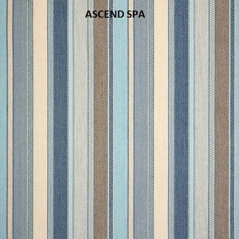 May include: A striped fabric with alternating bands of beige, blue, and brown. The fabric has a subtle woven texture. The text "ASCEND SPA" is printed in the center of the fabric.