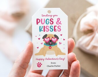 May include: A white gift tag with a pink and blue illustration of a pug wearing heart-shaped sunglasses. The text on the tag reads "Sending you PUGS & KISSES Happy Valentine's Day! from: Charlie Parker".