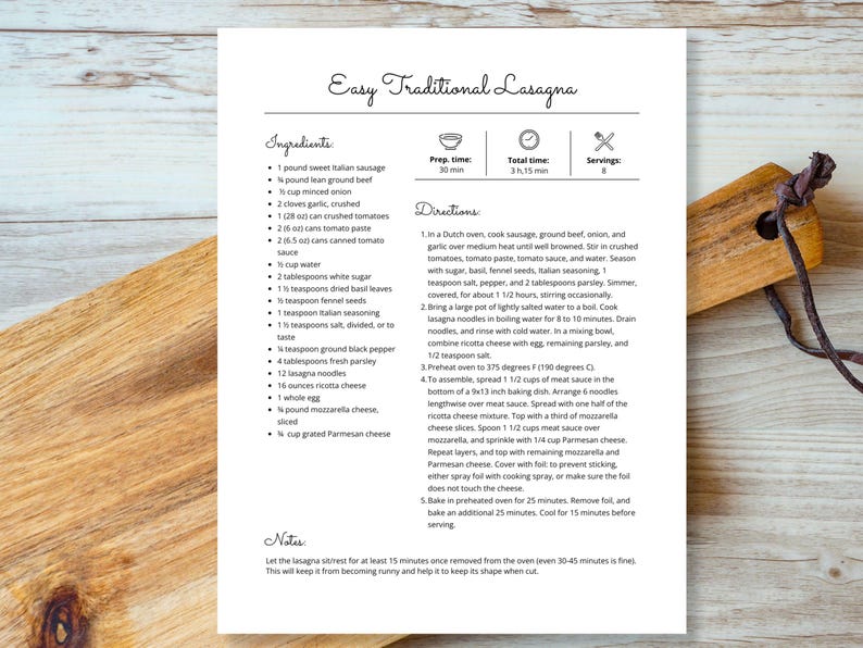 May include: A printed recipe for Easy Traditional Lasagna, featuring a list of ingredients and detailed instructions. The recipe includes measurements in ounces and pounds. The page is on a white background with a wooden cutting board.