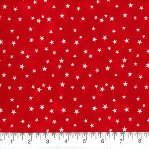 May include: Red fabric with a pattern of white stars of varying sizes. The stars are scattered across the fabric, creating a festive and playful design. The fabric is suitable for various craft projects and sewing.