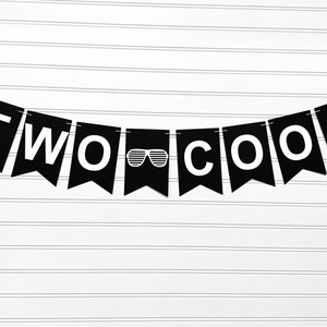 May include: A black banner with white text that reads "TWO COOL" strung across a white background. The letter "O" in "COOL" is replaced with a graphic of sunglasses.