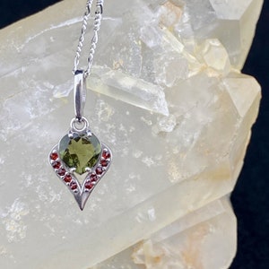 Bahula Means &quot;Star&quot;: A 7mm Faceted Genuine Moldavite Heart and Ribbons Studded with Bohemian Garnets Pendant