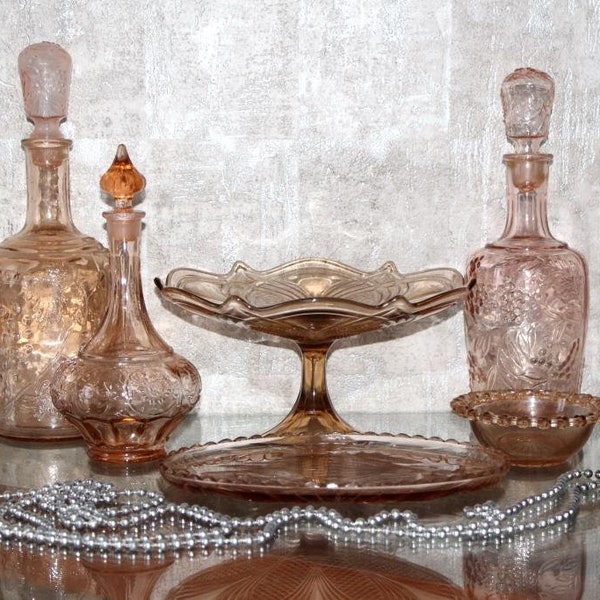 Vintage caramel glass table setting with decanters, tray, and fruit bowl