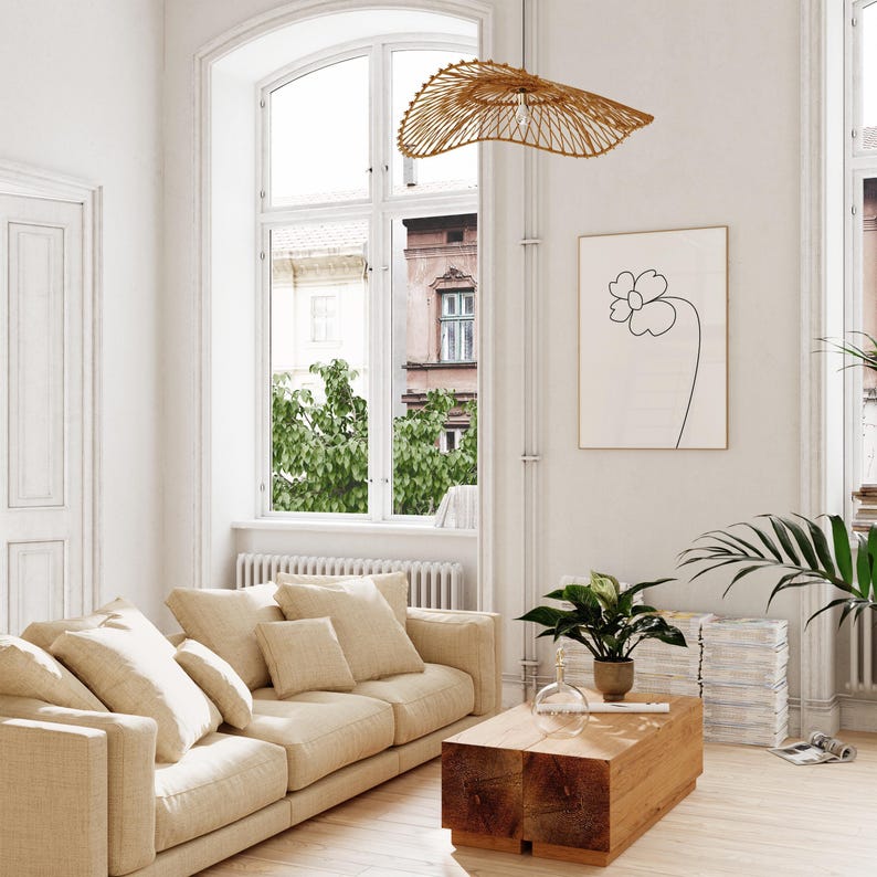 A bright and airy living room showing a printable wall art in situ