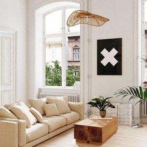 A bright and airy living room showing a printable wall art in situ