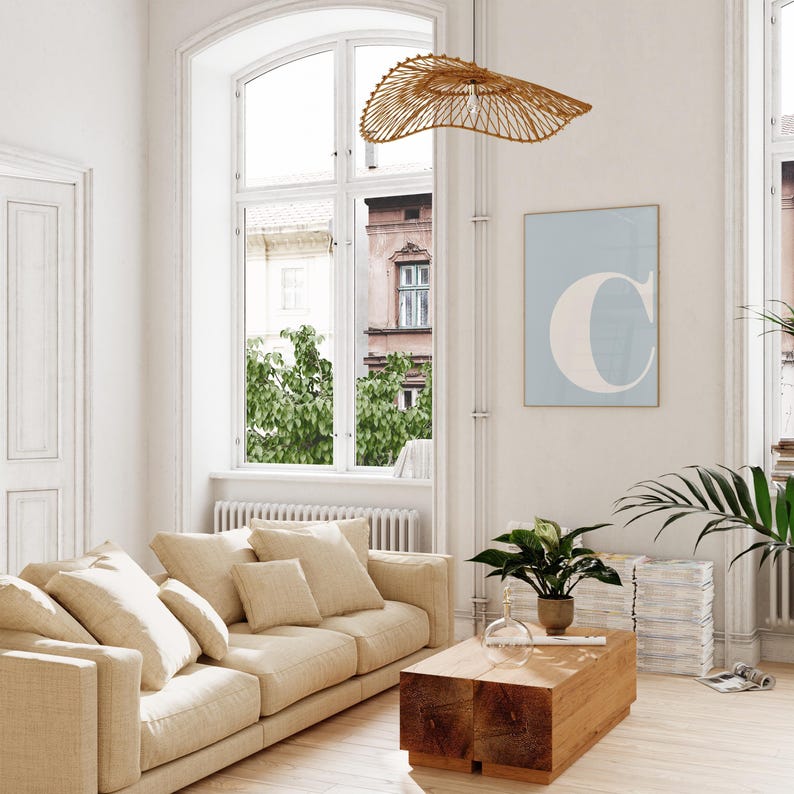 A bright and airy living room showing a printable wall art in situ