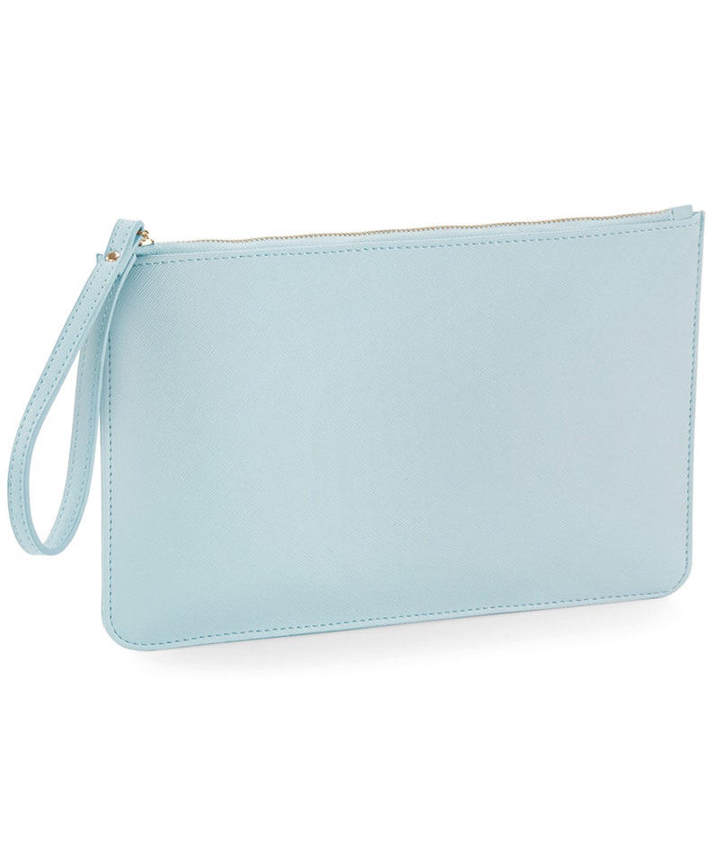 May include: A light blue clutch purse with a zipper closure and a wrist strap.