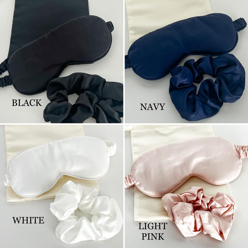 May include: Four sets of silk sleep masks and matching scrunchies in black, navy, white, and light pink.