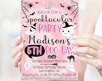 May include: A pink Halloween party invitation with the text "Join us for a Spooktacular PARTY Madison's 5th BOO-DAY". The invitation includes illustrations of ghosts, bats, spiders, and pumpkins. The invitation is held by a person.