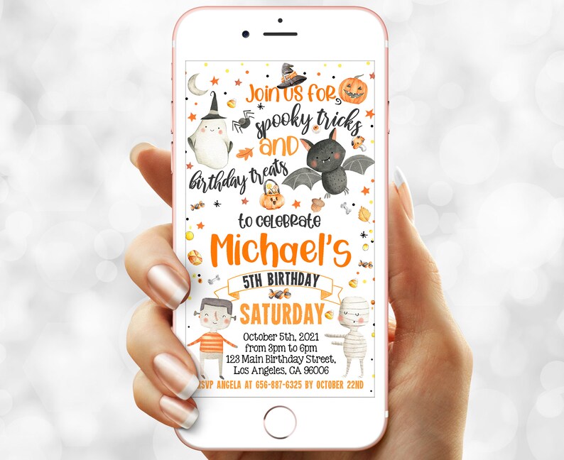 May include: A smartphone displays a Halloween-themed birthday invitation. The design features a bat, pumpkin, ghost, and the text "Join us for spooky tricks and birthday treats to celebrate Michael's 5th Birthday Saturday October 5th".