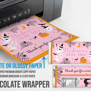 May include: Pink Halloween-themed chocolate wrapper with the text "Madison's 1st BOO-THDAY" and "Thank you for coming". The design includes ghosts, pumpkins, bats, and spiderwebs. Printed on matte or glossy paper.
