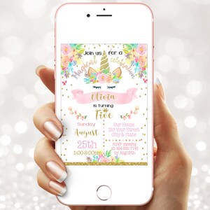 May include: A smartphone displays a birthday party invitation. The invitation features a unicorn design with floral accents, the name "Olivia," and event details including the date, time, and location. The background is a soft, blurred bokeh.