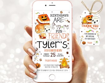 May include: A smartphone displays a birthday party invitation with a s'mores theme. The invitation includes text that reads "Birthdays are S'more Fun with Friends" and "Tyler's 8th Birthday". A matching tag is included with the invitation.