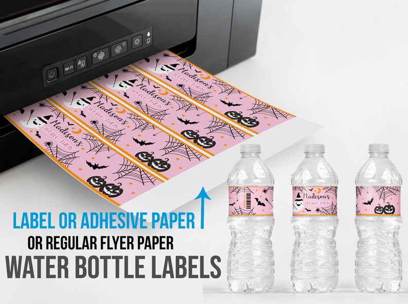 May include: Pink Halloween-themed water bottle labels with a repeating pattern of pumpkins, bats, and spiderwebs. The labels are printed with the text "Madison's 1st Birthday". The labels are shown being printed from a black printer.