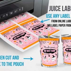 May include: Pink Halloween-themed juice pouch labels with the text "Madison's 1st Boo-Thday". The labels feature ghosts, bats, spiderwebs, and the words "Let's celebrate!". The image also shows a printer and juice pouches.
