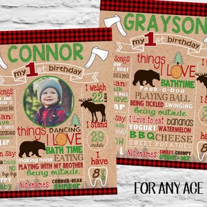 May include: Two personalized first birthday posters with a rustic theme. Each poster features a photo, the child's name, and details like favourite songs, things they love, and measurements. The posters are framed with a red and black plaid border.