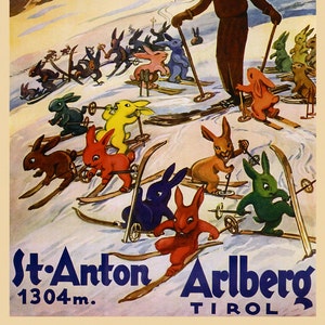 May include: A vintage travel poster advertising St. Anton Arlberg in Tyrol, Austria. The poster features a man skiing down a mountain with a group of colorful rabbits on skis. The text on the poster reads "St. Anton Arlberg 1304m. Tirol."