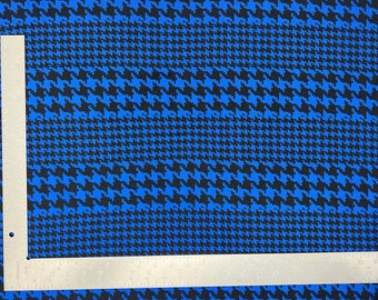 May include: Blue and black houndstooth fabric with a ruler for scale.