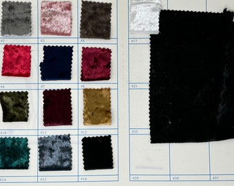 May include: A color chart of 32 fabric swatches. The swatches are arranged in rows and columns on a white background. The swatches are all different colors and textures, including velvet, corduroy, and cotton.