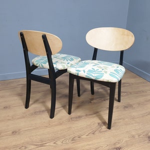 A Pair of Mid Century Nathan Butterfly Style Ebonised Dining Chairs Upholstered