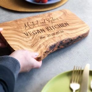 A beautifully designed, unique and custom engraved personalized gift. Crafted from rustic olive wood and ideal to use as chopping, serving, charcuterie or antipasti board, made from sustainable, natural olive wood.