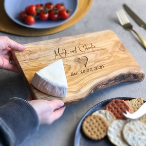 A beautifully designed, unique and custom engraved personalized gift. Crafted from rustic olive wood and ideal to use as chopping, serving, charcuterie or antipasti board, made from sustainable, natural olive wood.